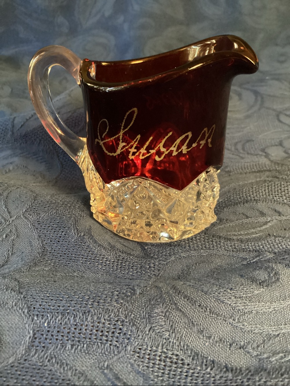 Antique 1906 Ruby stained souvenir glass creamer in the Button Arches pattern.